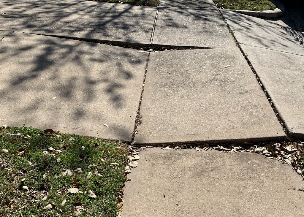 uneven concrete slabs spell disaster for young children playing on them