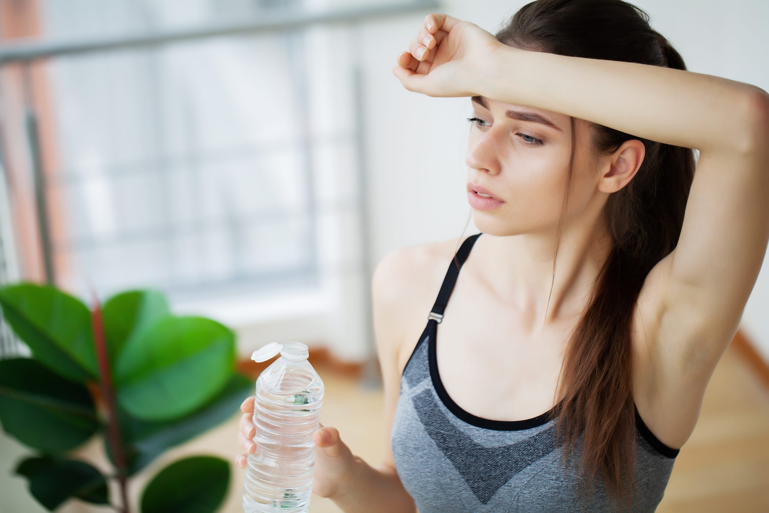 woman drinking water at the gym after working out 2025 02 14 19 25 38 utc scaled 1