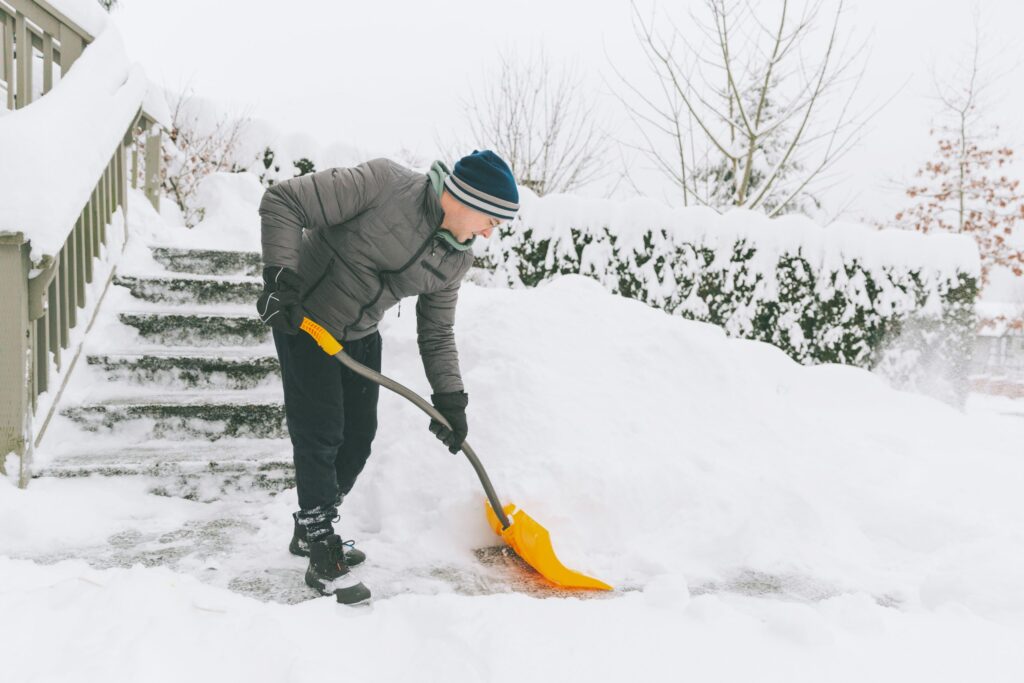 a man shovelling snow in winter 2021 08 29 02 38 37 utc