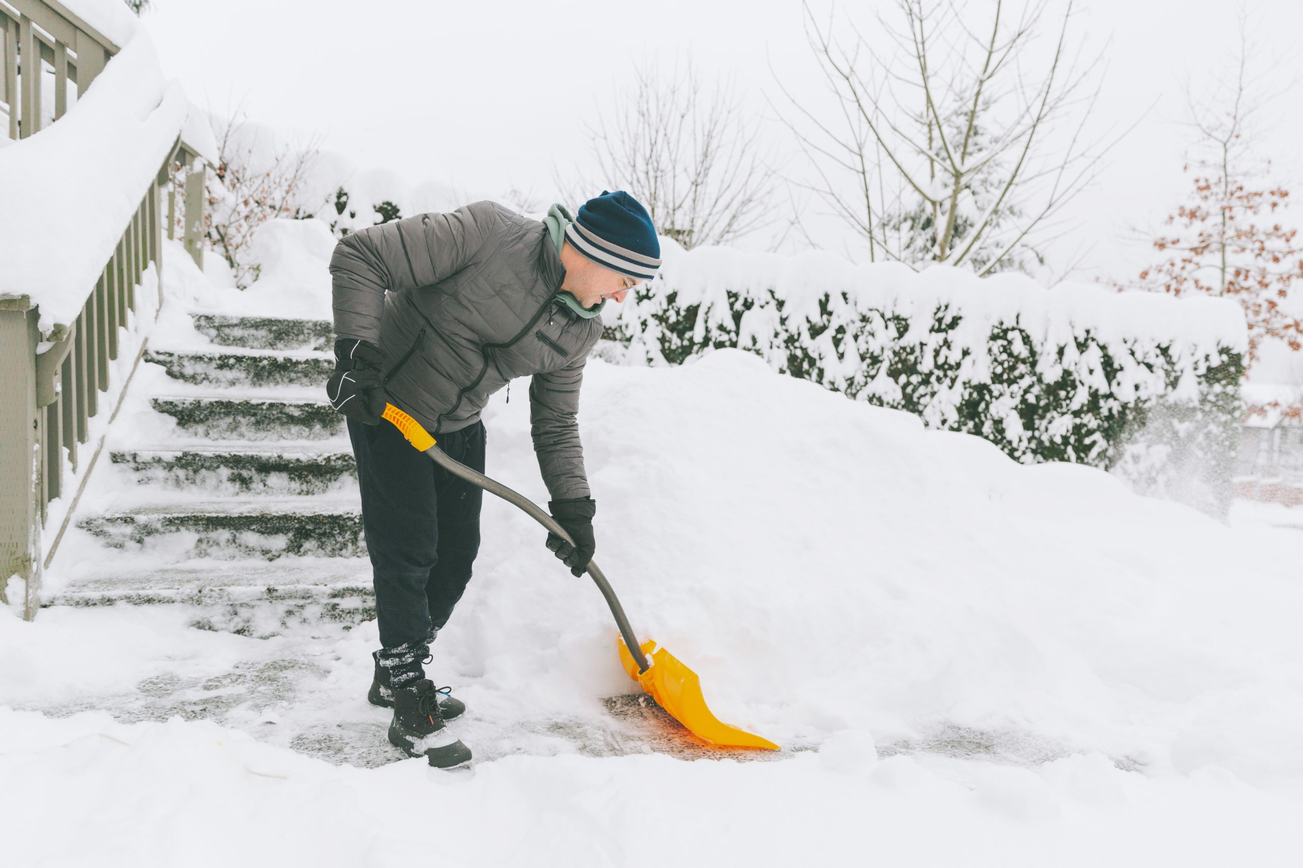 a man shovelling snow in winter 2021 08 29 02 38 37 utc